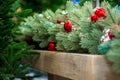 Christmas tree branches decorated with balls of red and silver colors Royalty Free Stock Photo