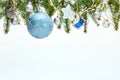 Christmas tree branches decorated with blue and silver balls, stars and glowing lights Royalty Free Stock Photo
