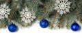 Christmas tree branches decorated with snowflakes and blue Christmas balls isolated on a white background Royalty Free Stock Photo