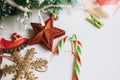 Christmas tree branches decorated with toys red star, snowflake and horse. Royalty Free Stock Photo