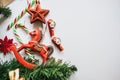 Christmas tree branches decorated with toys red star, snowflake and horse. Royalty Free Stock Photo