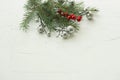 Christmas tree branches and decorations on a white textured horizontal background Royalty Free Stock Photo