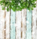 Christmas tree branches rustic wooden background snow