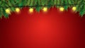 Christmas tree branches and stars lights over red background Royalty Free Stock Photo