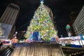 Christmas Tree at Campus Martius Park at night in downtown Detroit, Michigan at Christmastime. A giant Christmas Tree is on top of