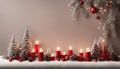 christmas tree with candles and decorations A cozy Christmas with a white hanging garland and a red background.