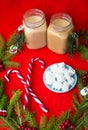 Christmas tree, candy, coffee marshmellou on a red background. Happy New Year Royalty Free Stock Photo