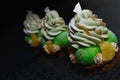 Christmas tree choux pastry desserts with oranges, pistachio ganache and white chocolate decorations