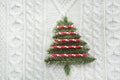 Christmas tree. Christmas concept with spruce, fir-tree, snowflakes on white knitted background. Holiday card. Vintage style. Royalty Free Stock Photo