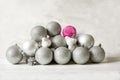 Christmas tree Christmas New Year silver and pink balls and decorative birds on a light background. Royalty Free Stock Photo