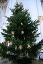 Christmas Tree in Church - Classical Christmas Tree with straw stars