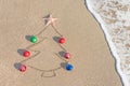 Christmas tree contour with decorations, star and wave on the beach