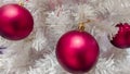 Christmas tree covered with snow. Xmas tree toys, balls and garland. Close-up Royalty Free Stock Photo