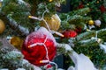 Christmas tree covered with snow. Xmas tree toys, balls and garland. Close-up Royalty Free Stock Photo