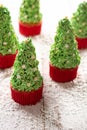 Christmas tree cupcakes on snow Royalty Free Stock Photo