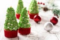 Christmas tree cupcakes on snow Royalty Free Stock Photo