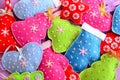 Christmas tree decor. Pretty felt Christmas trees, hearts, stars, mittens toys embellished with beads and snowflakes Royalty Free Stock Photo