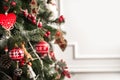 Christmas tree decor in red style and bokeh. Christmas tree, Christmas decorations, toys close-up and copy space. Hygge New Years Royalty Free Stock Photo