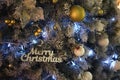 Christmas tree and decor with wooden words blue lights and color balls Royalty Free Stock Photo