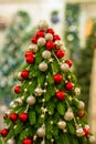 Christmas tree decorated with balls of red, gold and silver colors Royalty Free Stock Photo