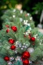 Christmas tree decorated with balls of red and silver colors Royalty Free Stock Photo