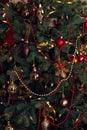 Christmas tree decorated with beads, balls, and a garland Royalty Free Stock Photo