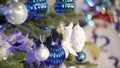 Christmas tree decorated with bright blue garlands and toys.Christmas tree decorated with bright blue garlands and toys