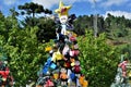 Christmas tree decorated with felt dolls and colorful bows at PraÃÂ§a do Pinho Bravo Royalty Free Stock Photo