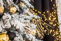 Christmas tree decorated with flowers and birds. Original decorations on branches of Christmas tree, New Year concept. Bokeh Royalty Free Stock Photo