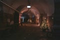 Christmas tree decorated with garlands in an ancient tunnel Royalty Free Stock Photo