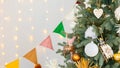 room interior with Christmas tree decorated with golden balls toys on blurred, sparkling and fabulous fairy tale background with Royalty Free Stock Photo