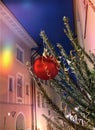 Christmas tree decorated illumination red gold ball   confetti on evening street in old town of Tallinn holiday in Estonia holiday Royalty Free Stock Photo