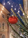 Christmas tree decorated illumination red gold ball   confetti on evening street in old town of Tallinn holiday in Estonia holiday Royalty Free Stock Photo