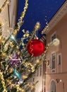 Christmas tree decorated illumination red gold ball   confetti on evening street in old town of Tallinn holiday in Estonia holiday Royalty Free Stock Photo