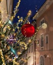 Christmas tree decorated illumination red gold ball   confetti on evening street in old town of Tallinn holiday in Estonia holiday Royalty Free Stock Photo