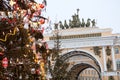 The Christmas tree is decorated with lamps and toys against sculpture on arch of the General Staff Building. The Palace Square, Royalty Free Stock Photo