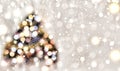 Christmas tree decorated with multicolored lights on a background of falling snow, golden snowflakes. Christmas background. Abstra Royalty Free Stock Photo