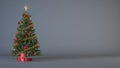 Christmas tree decorated with red and gold ornaments and presents on dark gray vertical background. Royalty Free Stock Photo