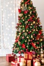 Christmas tree decorated with red and gold toys, Royalty Free Stock Photo