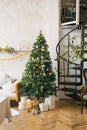 Christmas tree decorated with toys, dried lemons or oranges, garlands in the living room. Scandinavian Christmas style in the Royalty Free Stock Photo