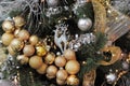 Christmas tree decorated with toys, garlands and ribbons. Royalty Free Stock Photo