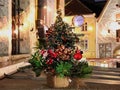 Winter   Tallinn holiday Christmas tree  decorated on  wooden  table top and street time  and  street time  in old town of T Royalty Free Stock Photo