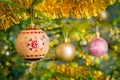 Christmas-tree decoration bauble on decorated Christmas tree bac Royalty Free Stock Photo