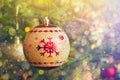 Christmas-tree decoration bauble on decorated Christmas tree bac Royalty Free Stock Photo