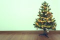 Christmas tree decoration in empty room with white wall Royalty Free Stock Photo