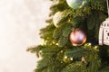 Christmas tree decoration, green fir branches with balls on gray background, copy space Royalty Free Stock Photo