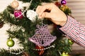 Christmas tree decoration in purple color on fir tree background