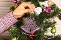 Christmas tree decoration in purple color on fir tree background