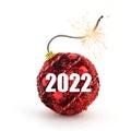 Christmas tree decoration. Red bomb ready to go off with golden sparkles on white background. New Year concept