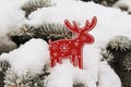 Christmas tree decoration a red deer (elk) on snow on a fir-tree Royalty Free Stock Photo